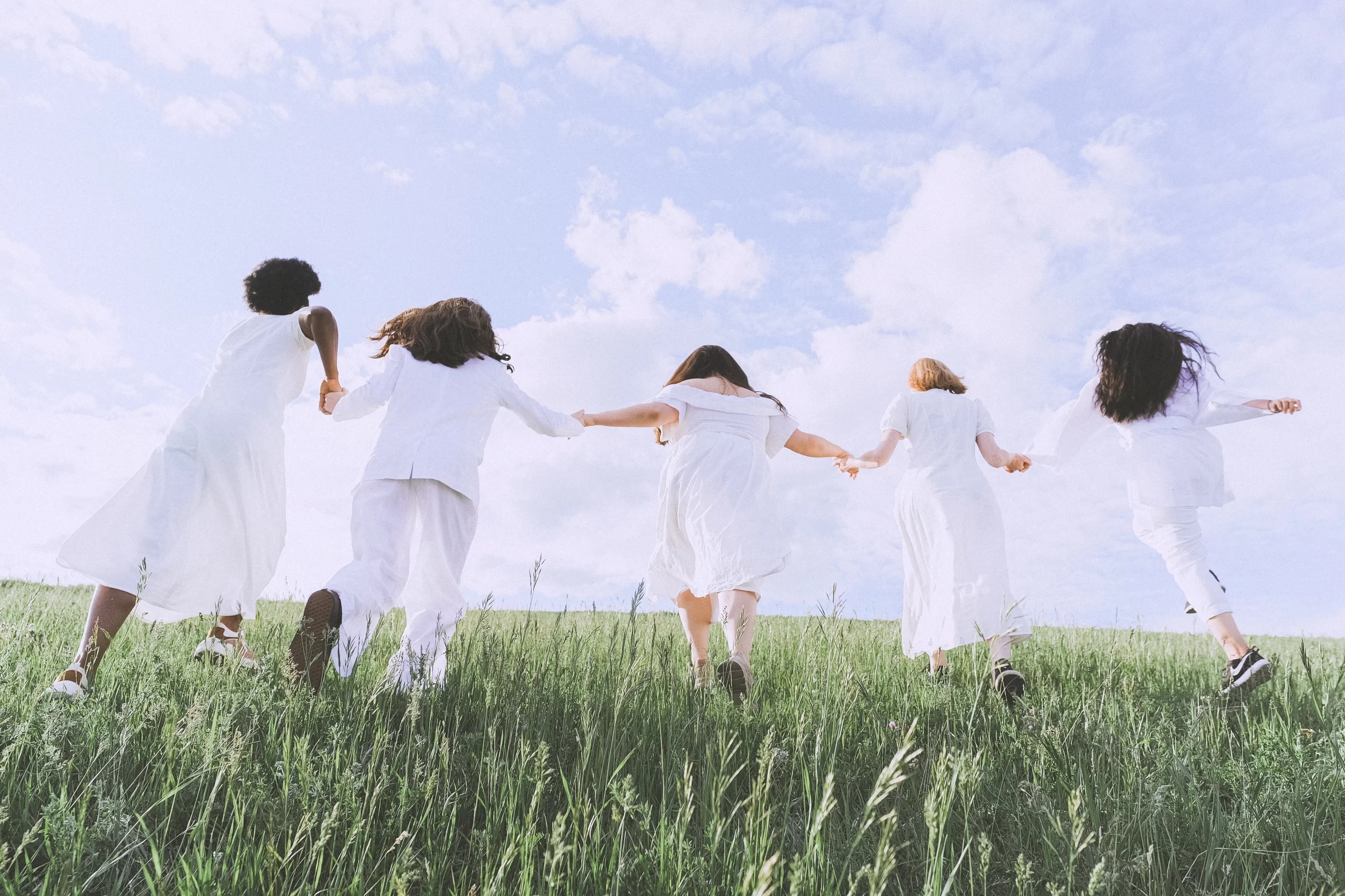 Group of friends having fun running together